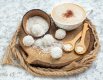 bottom-view-cup-of-cappuccino-bowl-with-coconut-powder-wooden-spoons-on-wood-board-on-grey-background